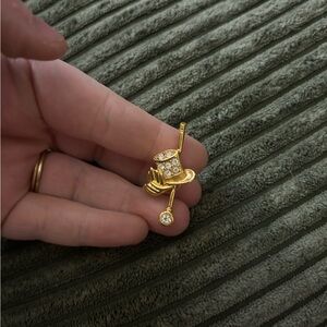 Avon gold-tone top hat and cane rhinestone lapel pin/brooch